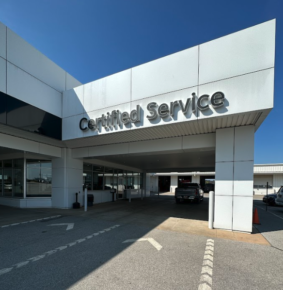 Certified Service entrance at Crain Buick GMC in Springdale, Arkansas on a clear spring day
